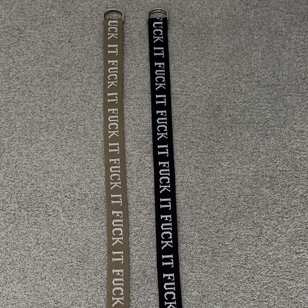 Black and Tan Belts with Bold saying